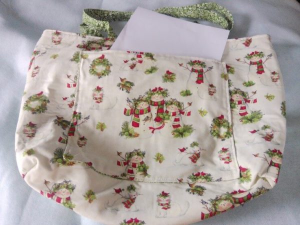 bag with green handle